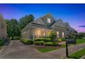 A beautiful two-story home with inviting front porch and well-maintained landscaping at 125 Rabbits Run, Fayetteville, GA 30215
