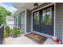 Inviting front porch with double doors, stylish decor, and lush greenery enhancing the entrance at 1217 Club Walk Ne Dr, Brookhaven, GA 30319