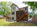 Back exterior with a screened porch, wooden deck, and access to the backyard at 2370 Burch Cir, Brookhaven, GA 30319