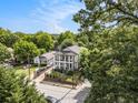 Aerial view of a two-story home nestled among lush trees in a quiet neighborhood at 918 Washington Sw St, Atlanta, GA 30315