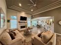 Inviting living room features a fireplace, coffered ceilings, neutral colors, and an open floor plan at 2610 Stokesley Way, Snellville, GA 30078