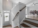 Inviting entryway with hardwood floors, staircase, and neutral paint color at 1582 Cambridge Pl, Marietta, GA 30062