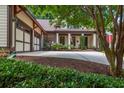 Beautiful home with a well-manicured lawn and a driveway that leads to a two-car garage at 9967 Devonshire St, Douglasville, GA 30135