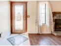 Beautiful foyer featuring hardwood floors, a decorative door, and natural light from a window at 2211 Jonathan Ave, Lithonia, GA 30058