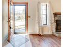 Inviting foyer with a decorative rug, gleaming hardwood floors, and a glimpse of the outdoors at 2211 Jonathan Ave, Lithonia, GA 30058