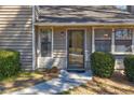 Close-up of the exterior entrance showing the door, stone detail, and a walkway at 2211 Jonathan Ave, Lithonia, GA 30058