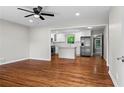 Open-concept kitchen featuring new stainless steel appliances and hardwood floors at 624 Lyle Se Dr, Marietta, GA 30067