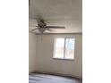 Bright bedroom featuring a ceiling fan, fresh paint, window, and modern flooring at 710 Singing Hills Ct, Roswell, GA 30076
