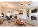 Inviting living room boasts a fireplace, plush carpet, and seamlessly blends into dining at 4544 Parkview Sq, Atlanta, GA 30349