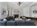 Cozy living room featuring fireplace, sofa, area rug, and decor at 75 Ponce De Leon Ave # 701, Atlanta, GA 30308