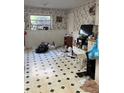 A kitchen featuring patterned tile flooring and lots of natural light from the window at 3838 Dunbury Ln, Decatur, GA 30032