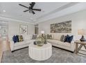 Elegant living room featuring two sofas, a plush rug, and ample seating space for entertaining at 99 Silver Leaf Trce, Douglasville, GA 30134