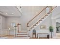 Spacious foyer with wood floors and staircase leading to the second level at 2250 Norbury Se Dr, Smyrna, GA 30080