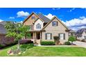 Beautiful two-story home featuring a landscaped yard, brick and stucco accents, and inviting porch at 1054 Morgan Garner Sw Dr, Lilburn, GA 30047