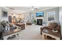 Open-concept living room features a fireplace, recessed lighting, and seamless transition to the kitchen at 2126 Roberts View Trl, Buford, GA 30519