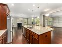 Spacious kitchen with granite countertops, stainless steel appliances, and hardwood floors at 1045 Fords Crossing Nw Dr, Acworth, GA 30101