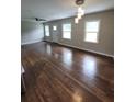 Spacious living room with recessed lights, fan, wood floors and a stylish light fixture at 2127 Whites Mill Rd, Decatur, GA 30032