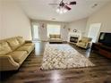 Spacious living room with hardwood floors, fireplace, and large windows at 2550 Kentshire Way, Lawrenceville, GA 30044