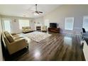 Inviting living room with hardwood floors, high ceilings, fireplace and plenty of natural light at 2550 Kentshire Way, Lawrenceville, GA 30044