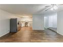 Open-concept floor plan connecting the kitchen and living room area with hardwood floors at 6715 Kimberly Mill Rd, Atlanta, GA 30349
