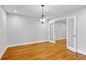 Bright room featuring hardwood floors and glass paneled french doors at 1719 Woodcliff Ne Ct, Atlanta, GA 30329