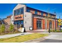 Spacious brick building with large windows and a stylish entrance at Homestead at 2255 Windsor Bluffs Dr, Cumming, GA 30041
