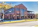 Exterior view of Crooked Culture, showcasing its modern brick facade and inviting outdoor seating at 2255 Windsor Bluffs Dr, Cumming, GA 30041