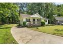 Cozy single-Gathering home with a concrete driveway and a welcoming front porch at 354 Henry Aaron Sw Ave, Atlanta, GA 30310