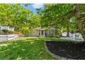 Inviting single-story home with a well-manicured lawn, white picket fence, and a charming front entrance at 1734 8Th St, Brookhaven, GA 30341