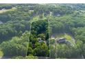 A bird's eye view of property and surrounding landscape outlined in white at 2024 Lower Burris Road Rd, Canton, GA 30114