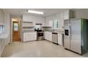Well-lit kitchen with stainless steel appliances and white cabinets at 2041 Kramer Way, Marietta, GA 30062