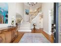 Grand foyer with hardwood floors, elegant staircase, and soaring ceilings at 3361 Woodington Se Ct, Marietta, GA 30067