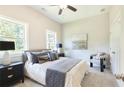 Cozy bedroom featuring neutral tones, plush bedding, and ample natural light at 3810 Jack Vernon Cir, Powder Springs, GA 30127