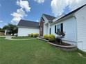 Well-manicured lawn and tasteful landscaping around the home's exterior at 2504 Dalesford Ct, Dacula, GA 30019