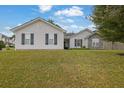 Charming single-story home with light siding, dark shutters, and a well-manicured lawn at 507 Hillcrest Cross Rd, Canton, GA 30115