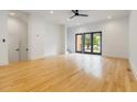 Bright living room with hardwood floors, recessed lighting, and large glass doors at 367 Parkway Ne Dr # 4, Atlanta, GA 30312