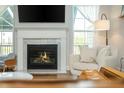Cozy living room featuring a fireplace, mantle, and comfortable seating at 996 Layton Dr, Buford, GA 30518