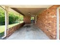 Open carport area with brick walls and a view of the backyard at 4065 Old Austell Rd, Powder Springs, GA 30127