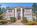 Grand brick home with stately columns and manicured landscaping at 7523 Kimberly Lynn Ct, Lithonia, GA 30058