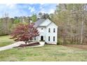 Two-story home on a manicured lawn features light green siding, landscaping, and blue skies at 1772 Brittany Chase Nw, Kennesaw, GA 30152