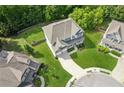 Expansive backyard and lush landscaping surround this well-maintained home in a desirable neighborhood at 1450 Rainfall Ct, Cumming, GA 30040