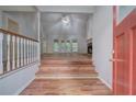 Inviting living room features vaulted ceilings, hardwood floors, and a cozy stone fireplace at 23 Timberlake Pointe Ne, Cartersville, GA 30121