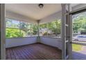 Bright, airy sunroom enclosed with many windows overlooking the outside at 3361 Myrtle St, Atlanta, GA 30354