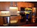 Well-equipped kitchen with stainless steel appliances, modern backsplash, and a dark countertop island at 172 Haynes Sw St # 107, Atlanta, GA 30313