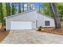 This single-story home boasts an attached garage and well-manicured landscaping providing great curb appeal at 1360 Terramont Dr, Roswell, GA 30076