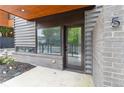 Inviting entryway to townhome featuring brick accents, large window, unit number, and protected entry at 367 Parkway Ne Dr # 5, Atlanta, GA 30312