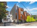 Contemporary townhome showcasing unique design elements, including wooden accents and private balcony at 367 Parkway Ne Dr # 5, Atlanta, GA 30312