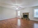 Bright living room featuring a fireplace, hardwood floors, lots of light and neutral-colored walls at 2918 Pavia Circle, Austell, GA 30106