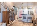 Inviting entryway with modern cabinet and bar seating adjacent to kitchen area at 3040 Peachtree Nw Rd # 1013, Atlanta, GA 30305