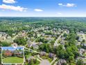 Stunning aerial view of the neighborhood showcasing the home's location within a lush, green community at 4955 Winding Rose Dr, Suwanee, GA 30024